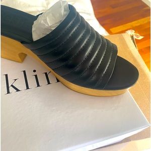 Brand new peep toe leather clogs by Beklina.